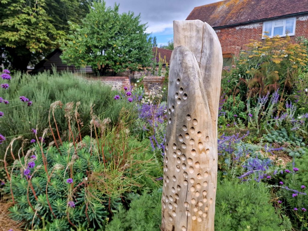 This deadwood sculpture acts as a solitary bee hotel - in the poshest high-rise!
